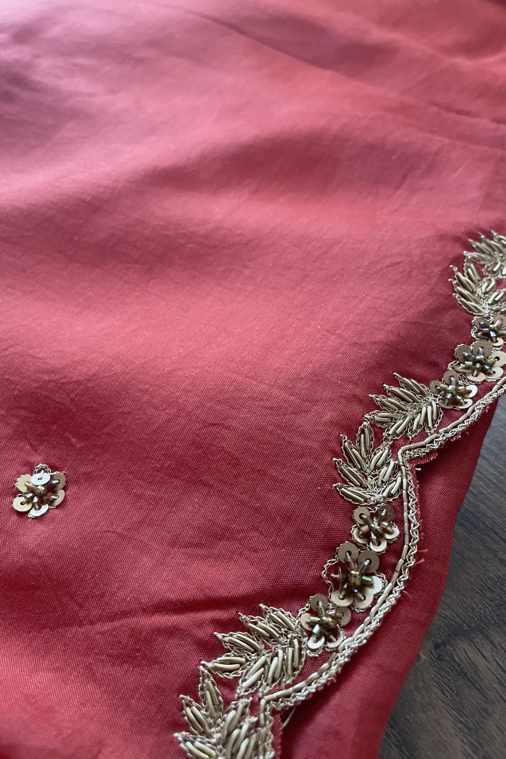 Rust orange muslin silk zardose handwork saree
